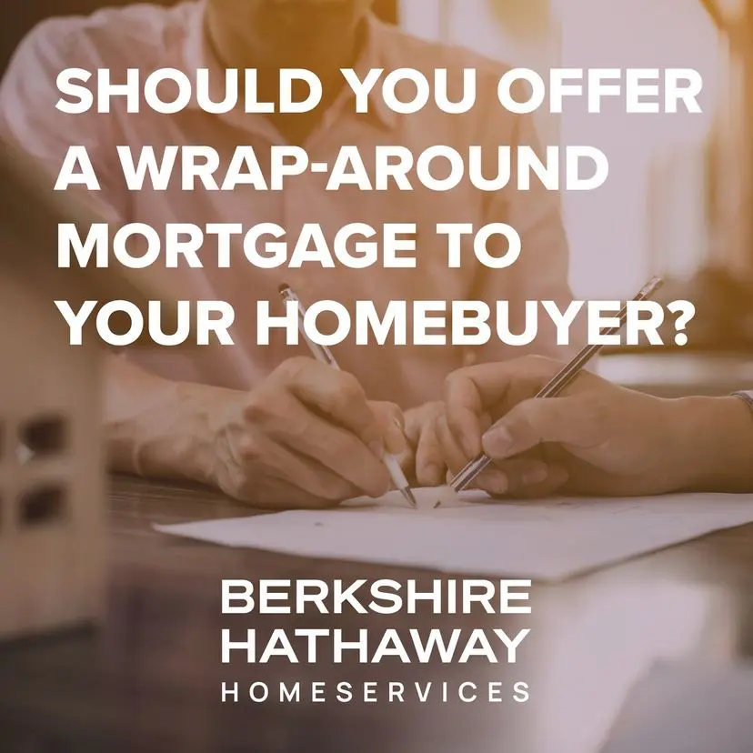 A person is writing on paper with the words " should you offer a wrap-around mortgage to your homebuyer ?" in front of them.