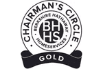A black and white picture of the chairman 's circle gold seal.